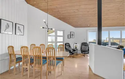 a dining room with a table and chairs at Stunning Home In Vestervig With Sauna in Vestervig