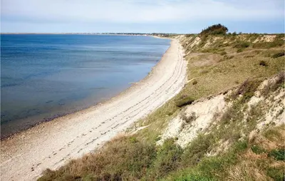 a view of a sandy beach next to the ocean at Stunning Home In Vestervig With Sauna in Vestervig