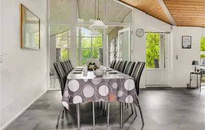 a dining room with a table and chairs at 4 Bedroom Lovely Home In Vestervig in Vestervig