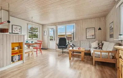 a living room with a couch and a table at Holiday Home Mølgårdsvej Thisted in Thisted