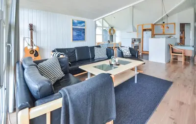 a living room with a couch and a table at Lovely Home In Thisted With Wifi in Thisted