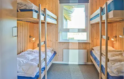 a bunk bed room with two bunk beds and a window at Stunning Home In Thisted With Sauna in Thisted