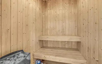 a wooden sauna with a bench in it at Stunning Home In Thisted With Sauna in Thisted