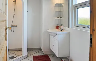 a bathroom with a sink and a window at Three-Bedroom Holiday Home In Thisted in Thisted