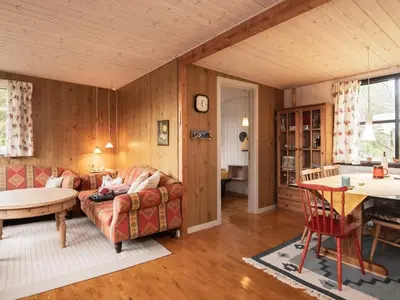 a living room with a couch and a table at Charming Cottage near Beach - By Traum Ferienwohnungen in Fjerritslev