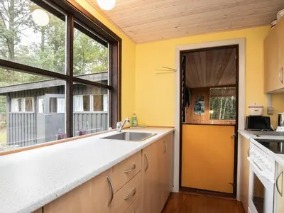 a kitchen with a sink and a large window at Charming Cottage near Beach - By Traum Ferienwohnungen in Fjerritslev