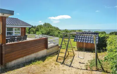 a solarium on the side of a house at Awesome Home In Spøttrup With Sauna in Spottrup