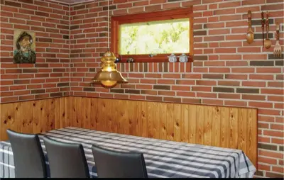 a dining room with a table and chairs and a window at Awesome Home In Spøttrup With Wifi in Spottrup