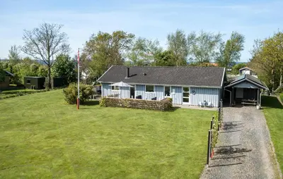 a house with a large yard in front of it at Holiday Home Sommerstedvej Denm in Vinderup