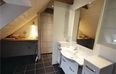 a bathroom with a sink and a mirror at Apartment Lysenvej in Roslev