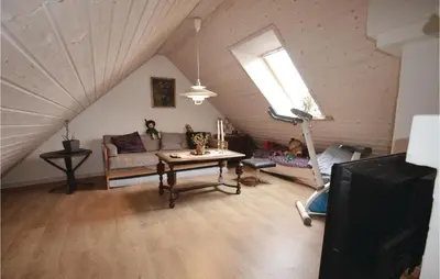 a living room with a couch and a table at Apartment Lysenvej in Roslev