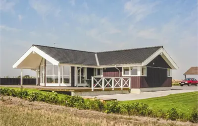 a house with a black roof at Holiday Home Houmøllevej in Karby