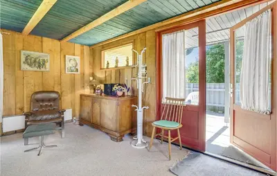 a room with a desk and a chair and a door at Holiday Home Sølvmågevej Hurup Thy Ii in Sindrup