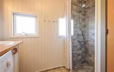 a bathroom with a shower with a glass door at Nice Home In Thisted With Kitchen in Thisted