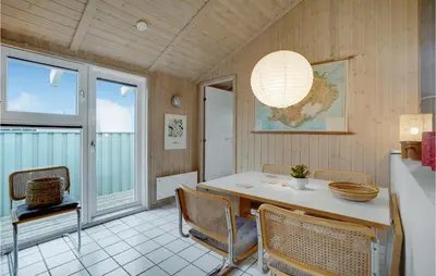 a dining room with a table and chairs at Holiday Home Kløvborgsti Thisted Ix in Thisted