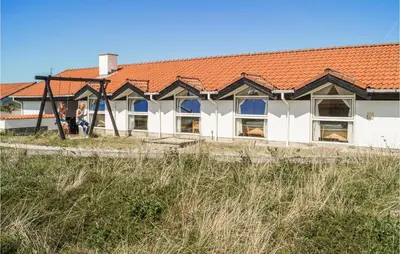 a white building with a red roof at Amazing Home In Thisted With Sauna in Thisted