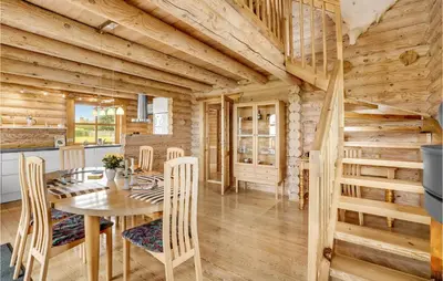 a dining room and kitchen with a table and chairs at Holiday Home Husvej in Fur