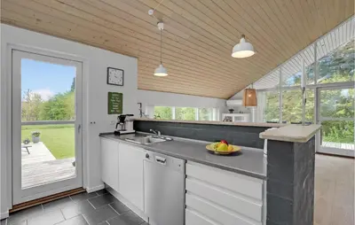 a kitchen with a sink and a counter top at Holiday Home Marthasvej in Løgstør
