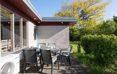 a table and chairs sitting on a patio at Holiday Home Bjarkesvej in Farsø