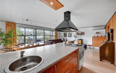a kitchen with a sink and a counter top at Holiday Home Eskovvej in Roslev
