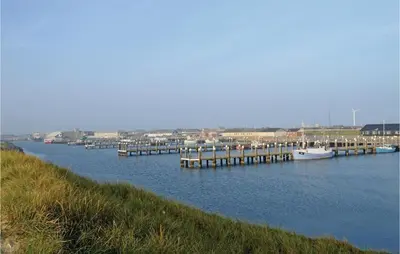 a body of water with boats docked at a dock at Holiday Home Hjelmevej Ulfborg Vi in Ulfborg