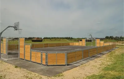 a basketball court with a basketball hoop at Holiday Home Kronvildtvej Brovst X in Brovst