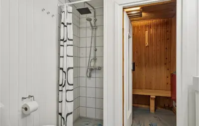 a bathroom with a shower and a toilet in it at 4 Bedroom Cozy Home In Brovst in Brovst