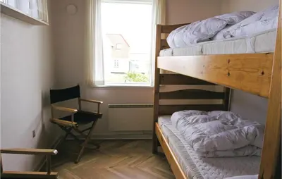 a bedroom with two bunk beds and a window at Gorgeous Home In Frøstrup With Wifi in Frøstrup