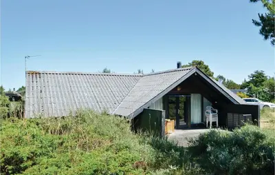 a small house with a pitched roof on a hill at Holiday Home C J Thaningsvej Fjerritslev X in Fjerritslev