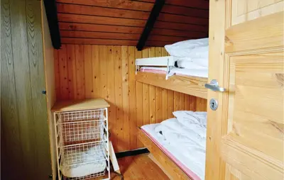 a room with two bunk beds and a cage at Holiday Home C J Thaningsvej Fjerritslev X in Fjerritslev