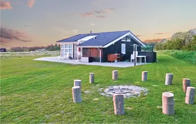 a small house in the middle of a field at Holiday Home Aspevej Fjerritslev Xi in Fjerritslev