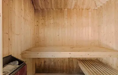 a wooden sauna with a wooden bench in it at Gorgeous Home In Fjerritslev With Wifi in Fjerritslev