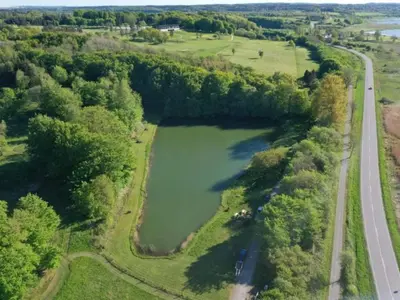 an aerial view of a lake next to a road at 8 person holiday home in Løgstør-By Traum in Løgstør