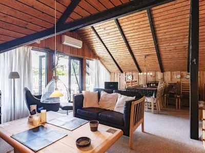 a living room with a couch and a table at 8 person holiday home in Løgstør-By Traum in Løgstør