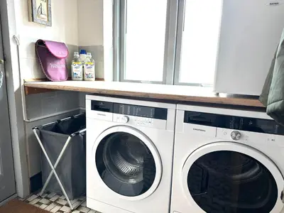 a laundry room with a washer and dryer at Beautiful villa close to beach and nature in Hanstholm