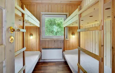 a room with two bunk beds and a window at Lovely Home In Saltum With Kitchen in Saltum