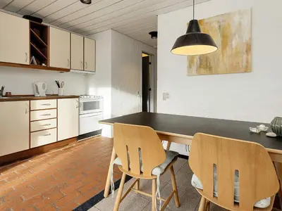 a kitchen with a dining table and two chairs at 4 person holiday home in Brovst-By Traum in Brovst
