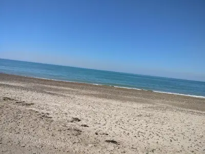an empty beach with the ocean in the background at 6 person holiday home in Brovst-By Traum in Brovst