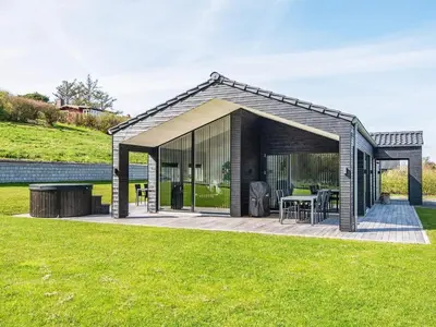 a pavilion with a table and chairs in a yard at 6 person holiday home in Lemvig-By Traum in Lemvig