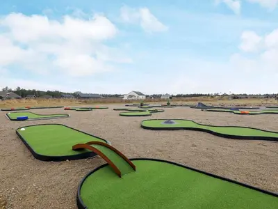 a bunch of green golf courses in a field at 8 person holiday home in Brovst-By Traum in Brovst