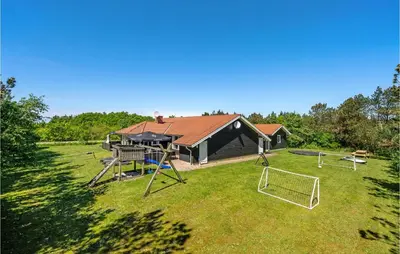 an aerial view of a house with a playground at Awesome Home In Løgstør With Sauna in Løgstør