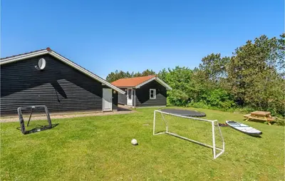 a yard with a soccer ball and a goal at Awesome Home In Løgstør With Sauna in Løgstør