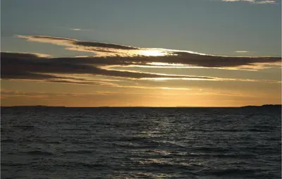 a sunset over a body of water at Awesome Home In Løgstør With Sauna in Løgstør