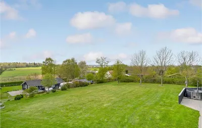 an aerial view of a large yard with a house at Holiday Home Illeris Xi in Farsø