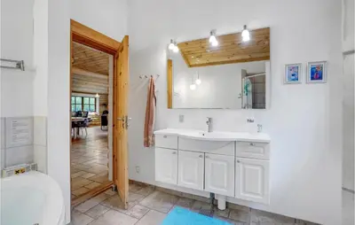 a bathroom with a sink and a toilet at Holiday Home Ramshule Farsø Xii in Farsø
