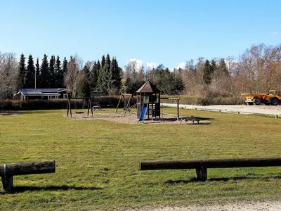 a park with a playground with a play equipment at 6 person holiday home in Farsø-By Traum in Farsø