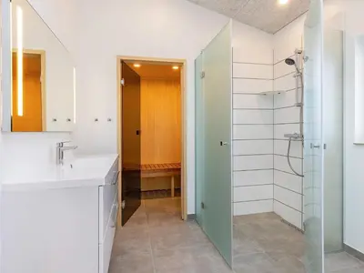 a bathroom with a sink and a shower at 10 person holiday home in Løkken-By Traum in Løkken