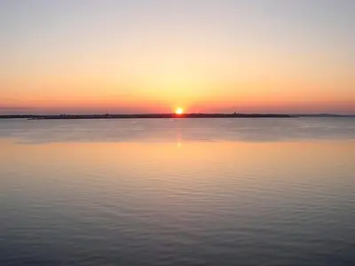 a sunset over a large body of water at 10 person holiday home in Vestervig-By Traum in Vestervig