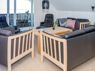 a living room with three couches and a table at 10 person holiday home in Vestervig-By Traum in Vestervig