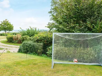 a soccer ball in the net of a goal at 6 person holiday home in Struer-By Traum in Struer